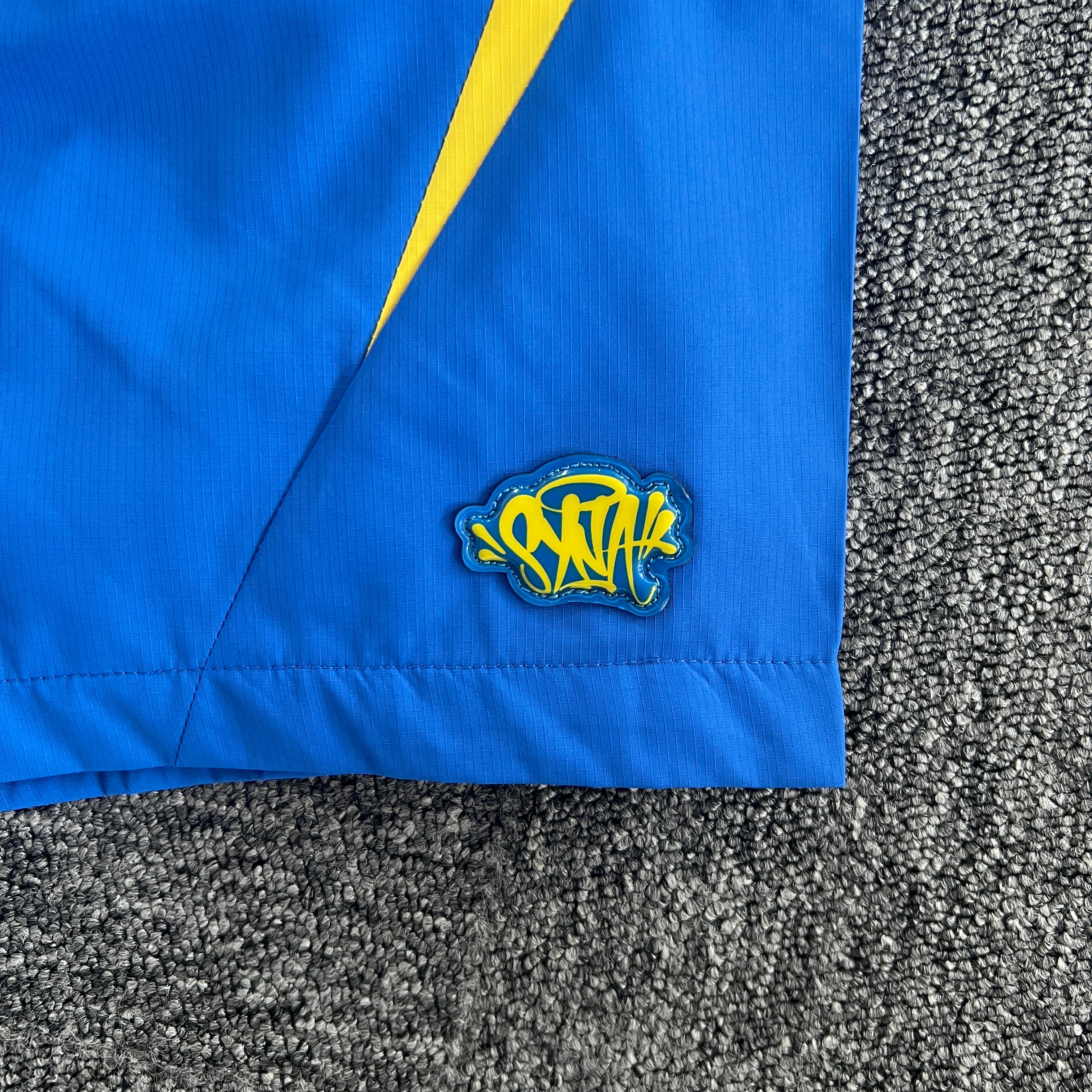 SYNA VORTEX TRACK SHORT- BLUE & YELLOW