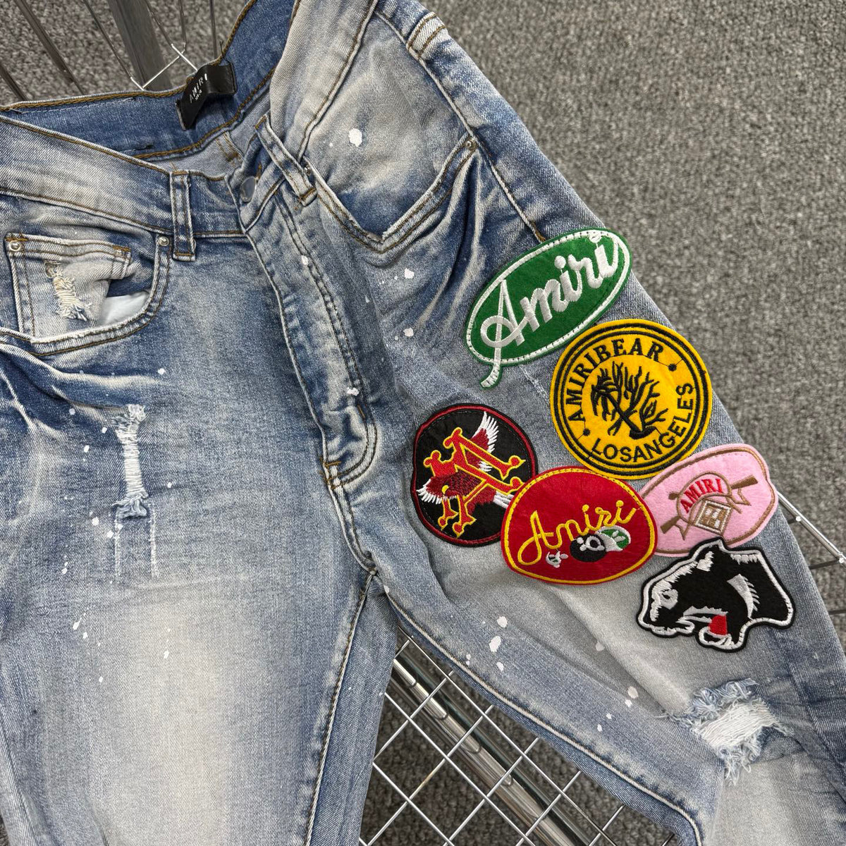 AMlRI BLUE BADGES JEANS