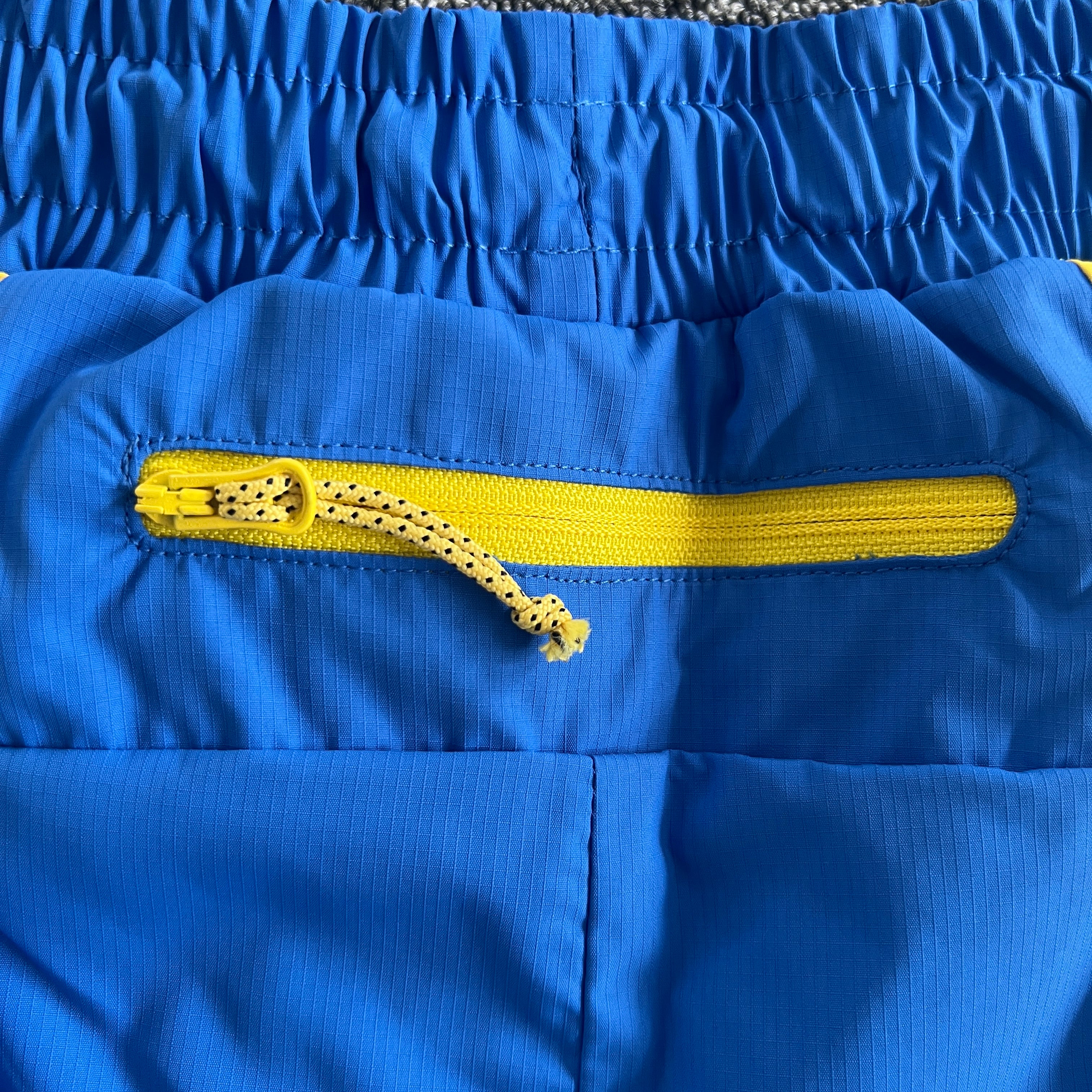 SYNA VORTEX TRACK SHORT- BLUE & YELLOW