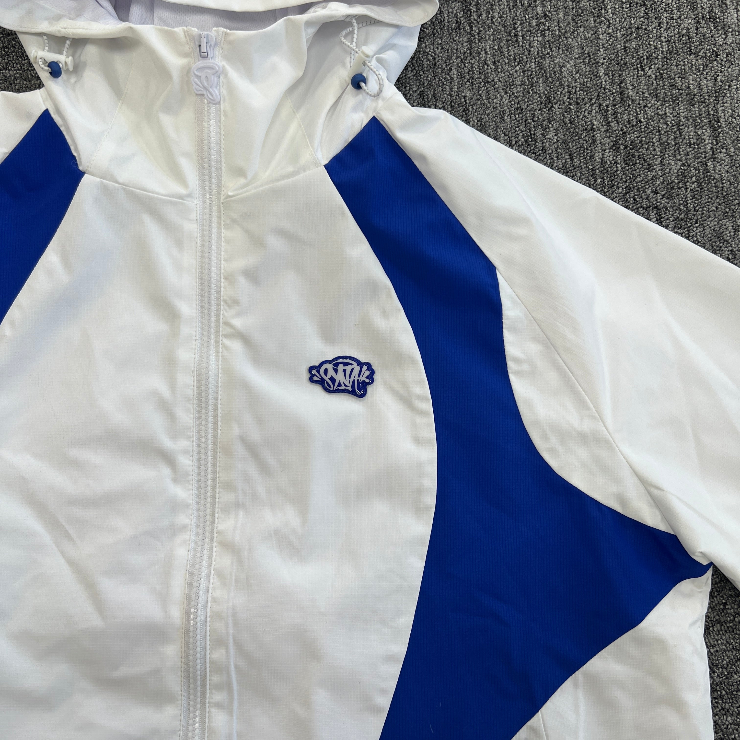 SYNA VORTEX TRACK TOP- WHITE & BLUE