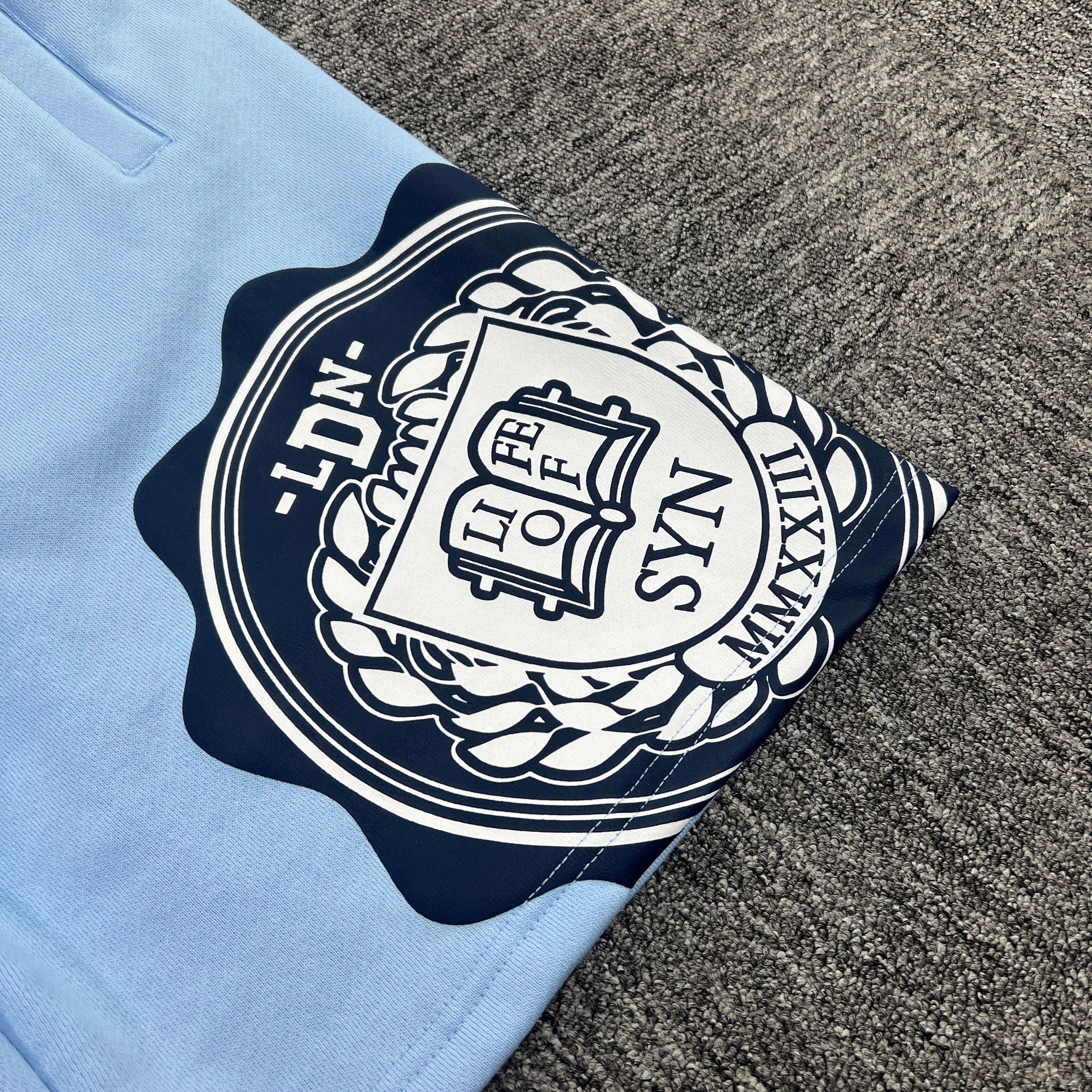 SYNA VARSITY CREW SHORT- BABY BLUE