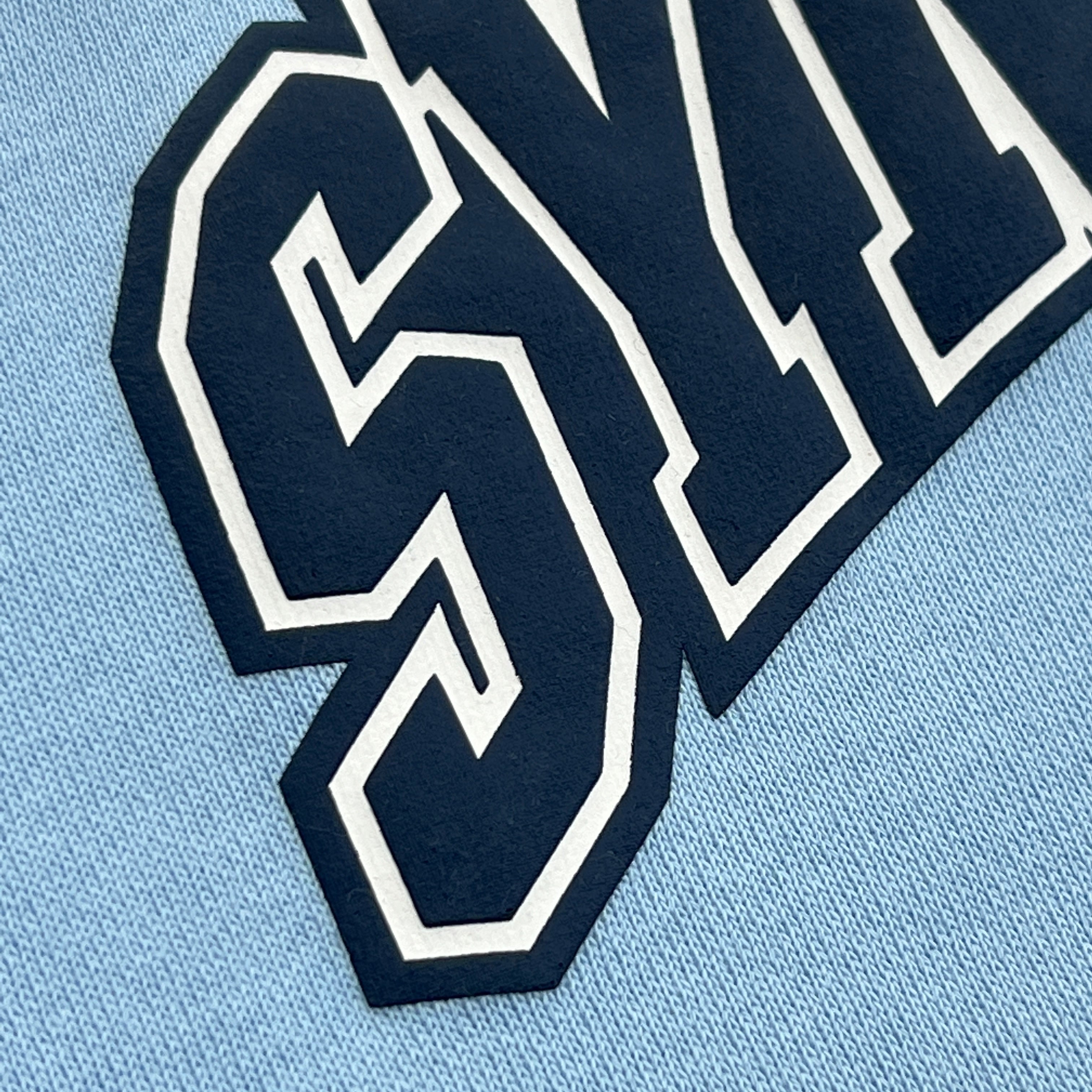 SYNA LONG SLEEVE VARSITY CREW SWEAT- BABY BLUE