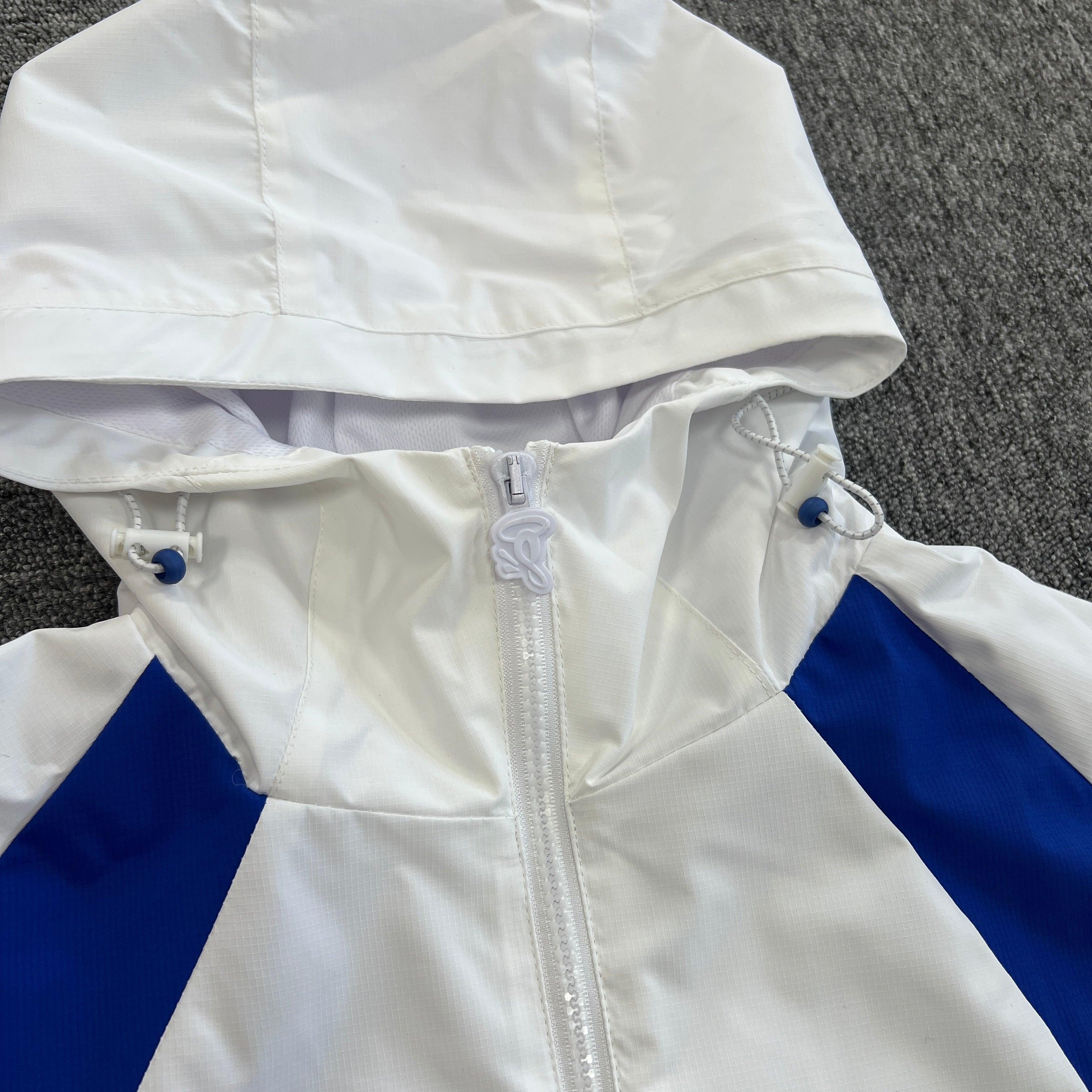 SYNA VORTEX TRACK TOP- WHITE & BLUE