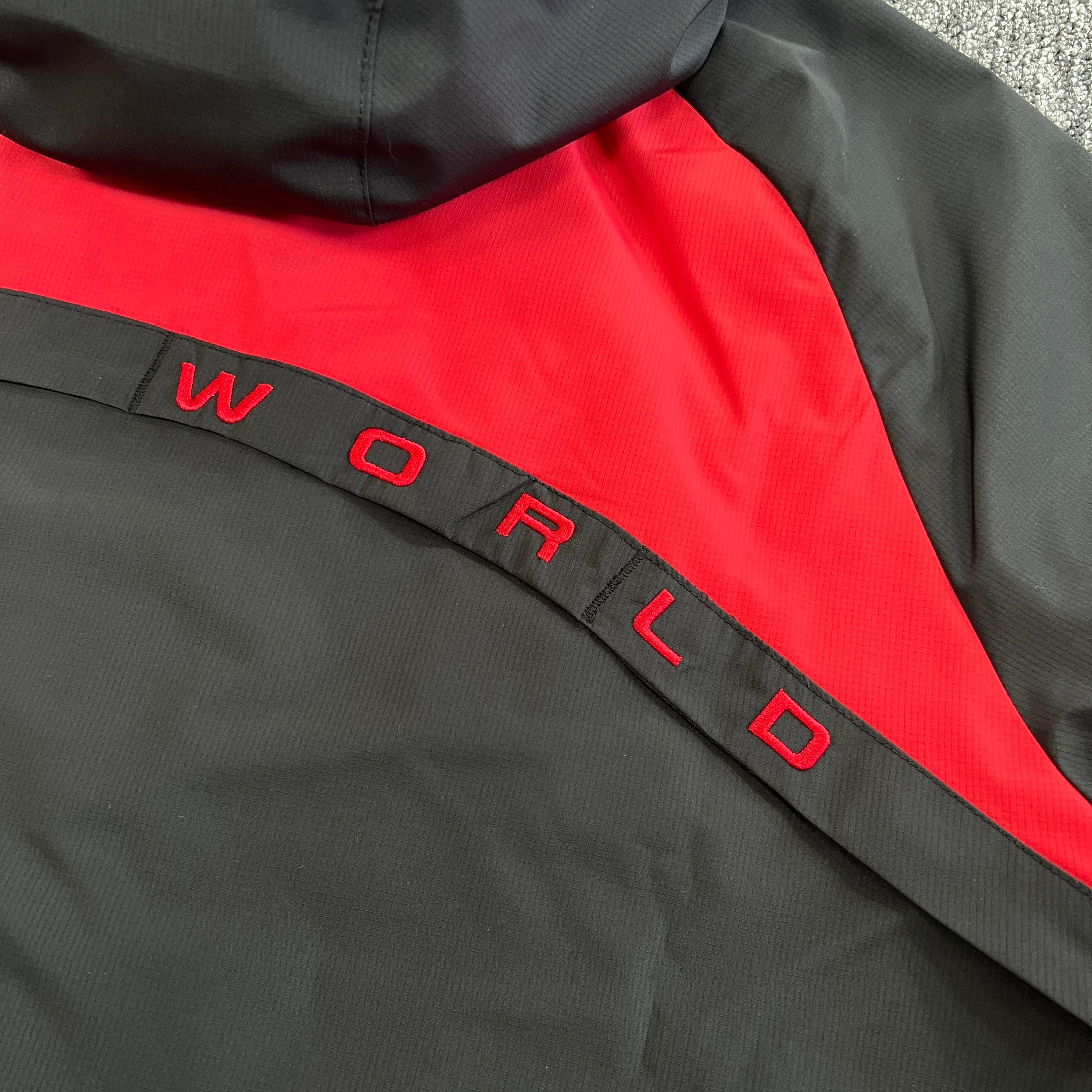 SYNA VORTEX TRACK TOP- BLACK & RED