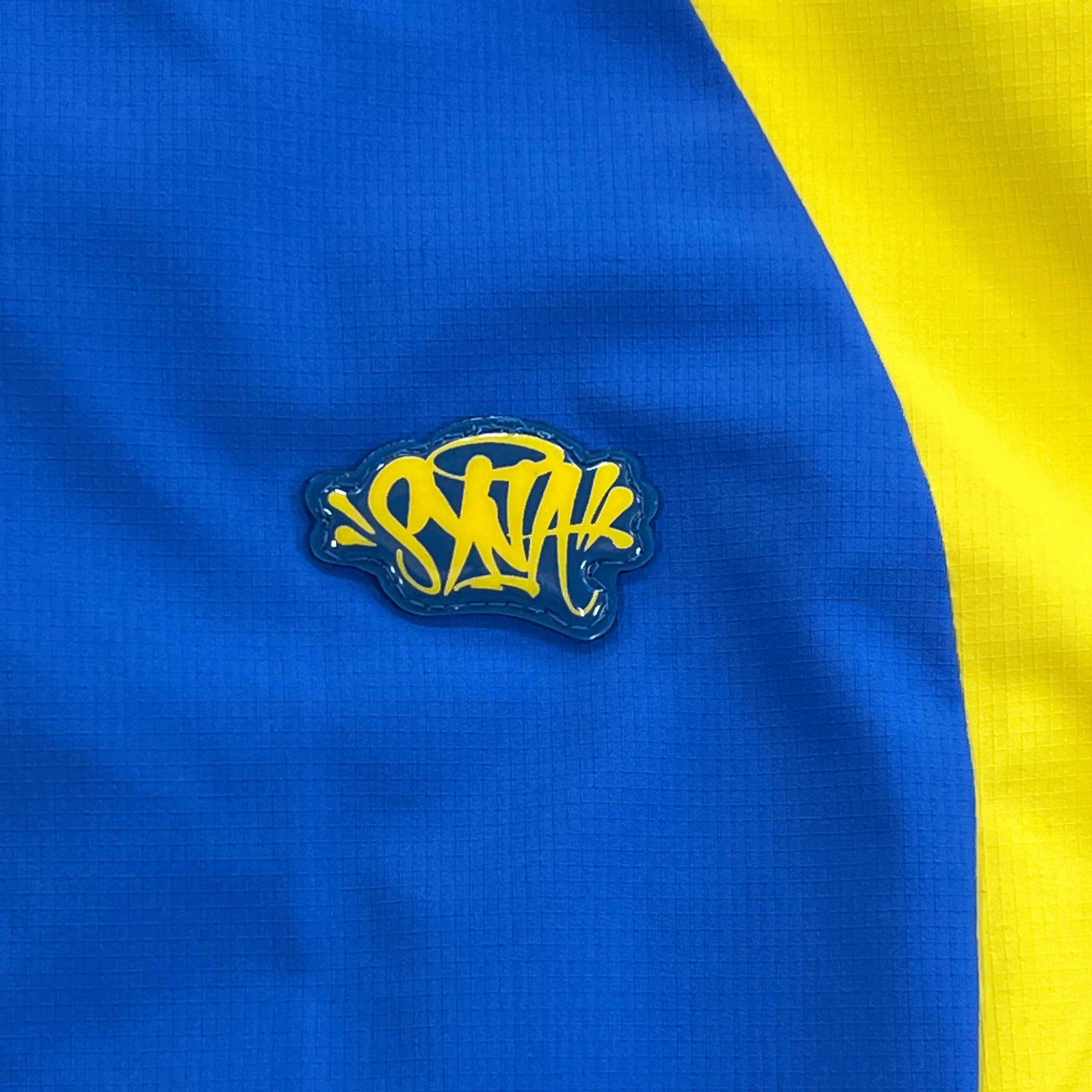 SYNA VORTEX TRACK TOP- BLUE & YELLOW