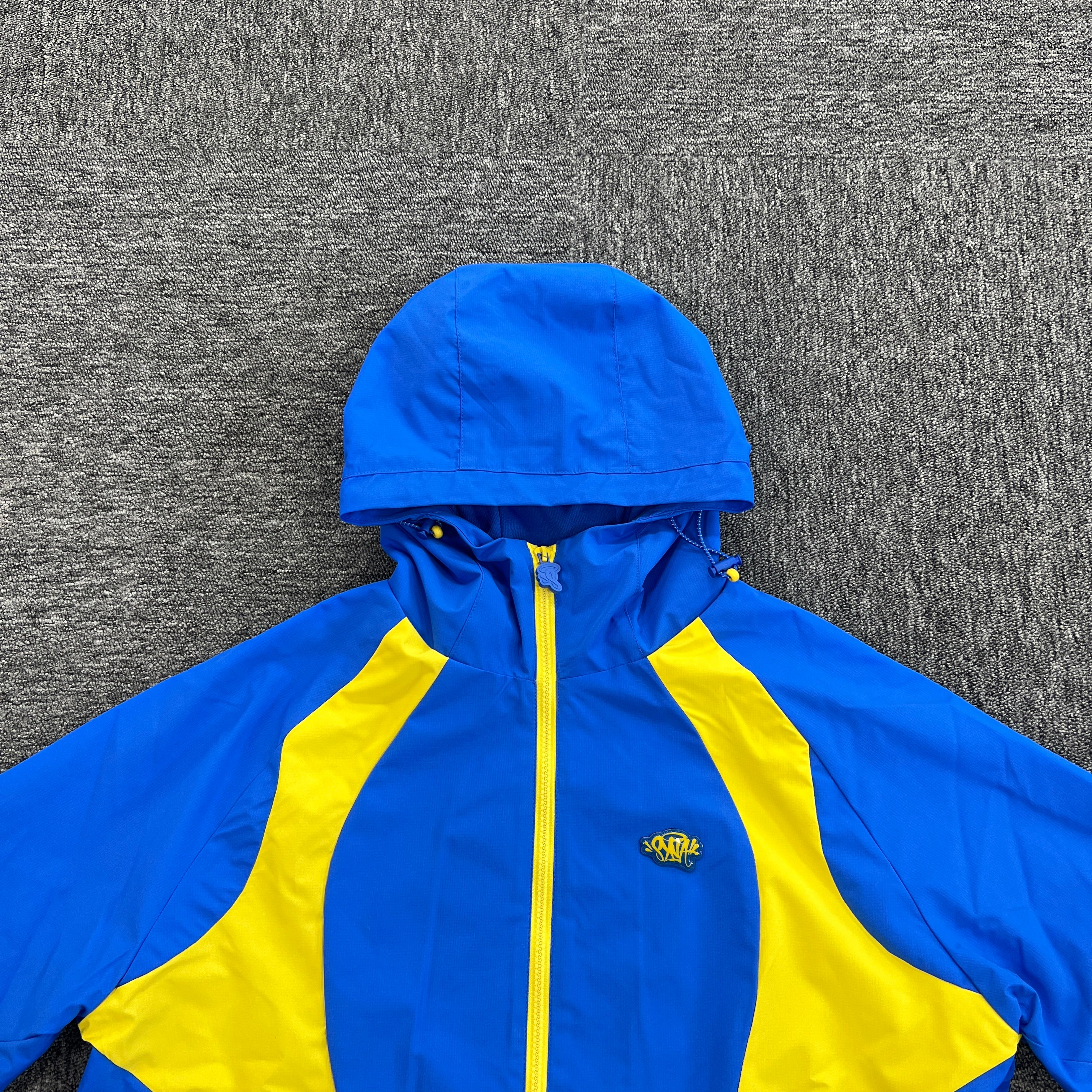 SYNA VORTEX TRACK TOP- BLUE & YELLOW